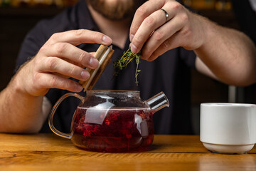 Tea brewing process, tea ceremony, a cup of freshly brewed tea, warm soft light. soft focus.
