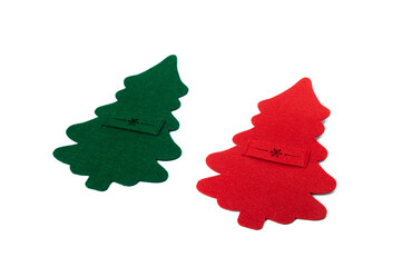 decorated red and green cutlery holders made of felt for New Year's table and cutlery on white background