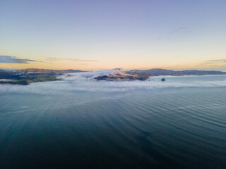 Drone shot of Sea level cloud inversion 