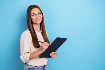 Photo of boss millennial lady write paper wear eyewear grey shirt isolated on blue color background