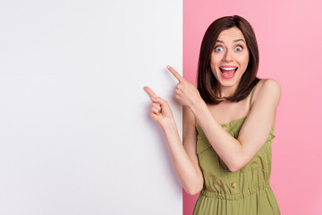 Photo of astonished lady arm demonstrate present empty space wall billboard unexpected reaction...