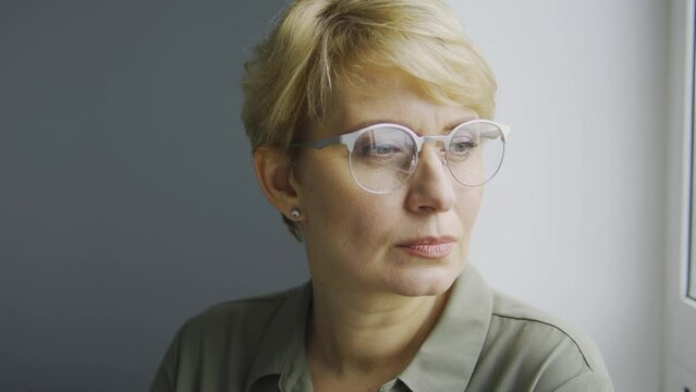 Dissatisfied teacher looking in window at pupils missing lessons, indignation