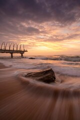 Vertical shot of a magical sunset over the Umhlanga beach