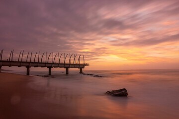 Fototapeta premium Scenic view of a magical sunset over the Umhlanga beach