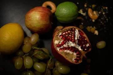 Deurstickers pomegranate on the table © reznik_val