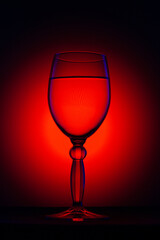 a glass on a black background with light