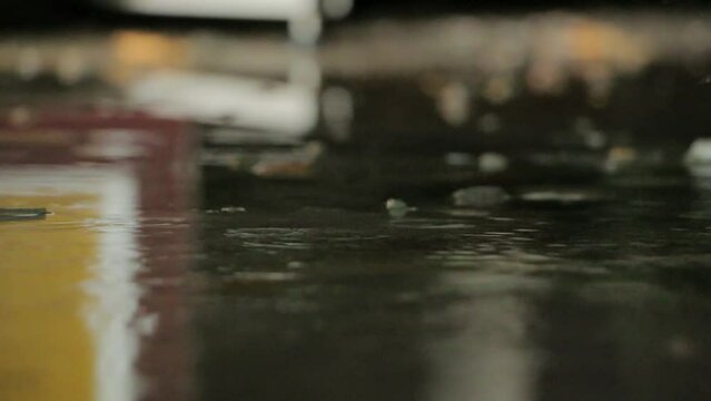 Water is dripping from ceiling to the floor. Water leaking from the ceiling in the warehouse