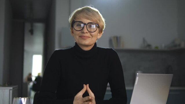 Smiling successful lady giving interview to famous magazine about popular people