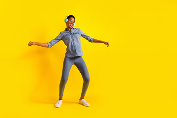 Fototapeta na wymiar Full length portrait of cheerful satisfied person enjoy free time chilling isolated on yellow color background