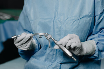 A surgical urethroscope in the hands of a doctor