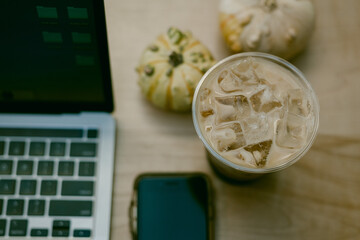 Iced coffee, laptop and cell phone