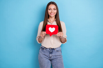 Photo of pretty lovely lady blogger two arm hold red paper feedback card toothy shiny smile isolated on blue color background