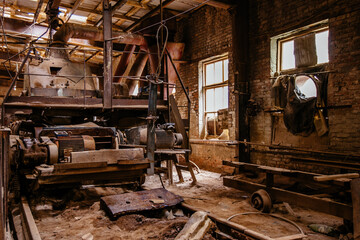 Fototapeta na wymiar Old broken empty abandoned factory with rusty machines