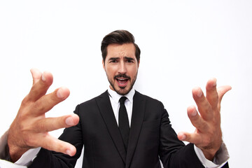Portrait of a man in an expensive business suit close-up wide-angle lens pulls his hands into the camera with open mouth surprise happiness smile with teeth on a white background, copy space