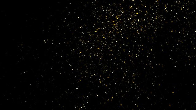 Gold ink in water shooting with high speed camera. Gold glitter background with sparkle shine light confetti. Super Slow Motion at 1000fps. effect.
