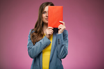 School teacher woman covered her face with book. Isolated advertising portrait on pink.