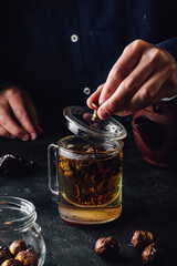Steeping red tea in glass mug