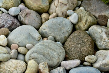 Big and small colourful pebbles background