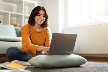 Online Education. Smiling Young Arab Woman Study With Laptop At Home