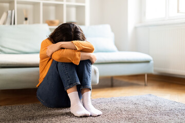 Depression Concept. Portrait Of Upset Young Middle Eastern Woman Crying At Home