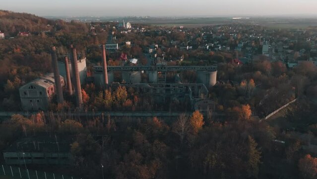 Abandoned old production plant, cement plant in Bedzin, Grodzisk, Poland. Concept of abandoned places, industrial ruins, urbex. View from the drone, air.