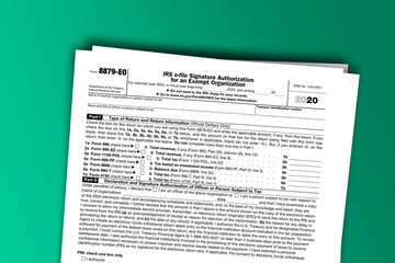 Fototapeta premium Form 8879-EO documentation published IRS USA 43872. American tax document on colored