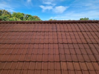 Metal tiles.  the roof of the house with a lighter and stronger steel material