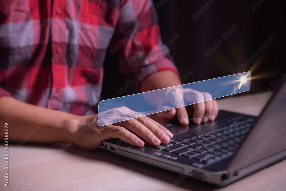 Poster man hand typed on the laptop keyboard to search for information in a virtual search screen box