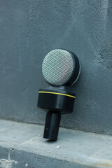 microphone is black with yellow stripes and silver on a gray background