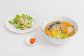 Bun ca Da Nang, Vietnamese rice noodles and grilled chopped fish, Vietnamese food isolated on white background, perspective view