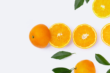 Orange fruit with green leaves on white background.