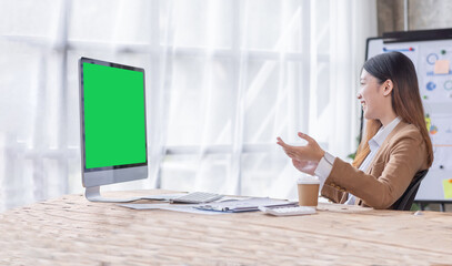 Young Asian woman having Zoom video conferencing call via computer. Home office. Stay at home and work from home concept 