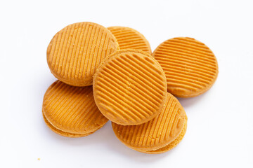 Custard cream sandwich biscuits on white background.