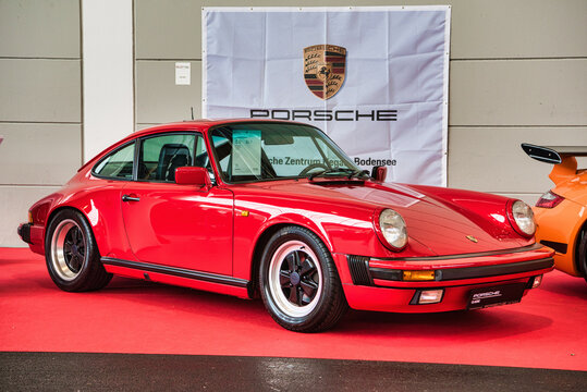 FRIEDRICHSHAFEN - MAY 2019: red PORSCHE 911 930 CARRERA 1977 cabrio at Motorworld Classics Bodensee on May 11, 2019 in Friedrichshafen, Germany
