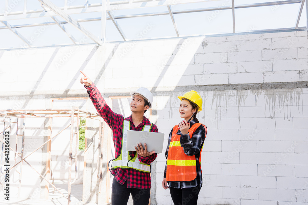 Poster asian engineer foreman worker man and woman working at building construction site use laptop and tal