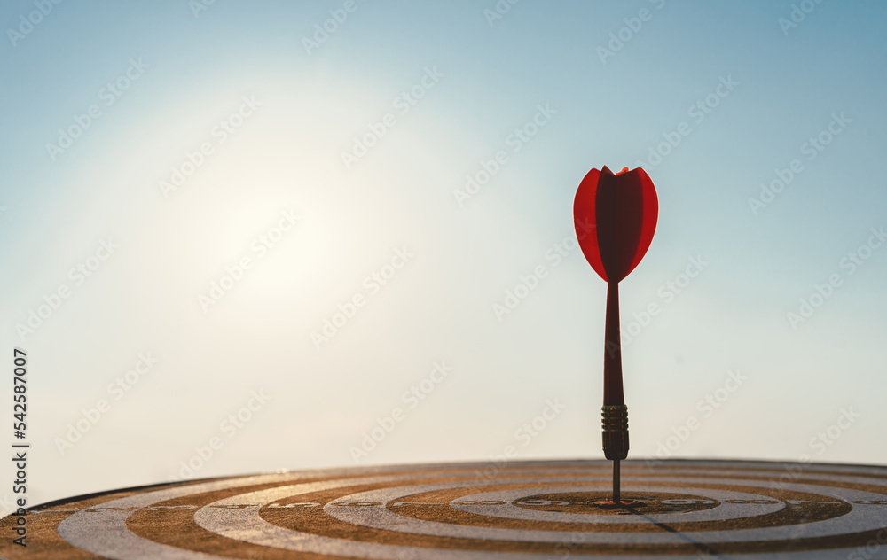 Fototapete business marketing target strategy as concept. red dart arrow hitting in the target center of dartbo
