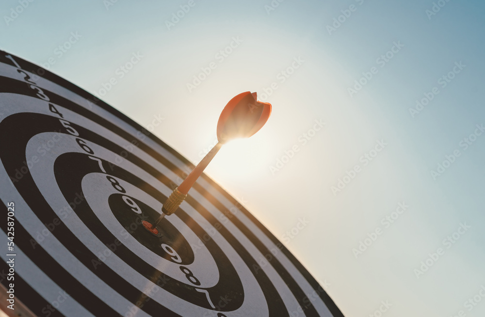 Fototapete Business marketing target strategy as concept. Red dart arrow hitting in the target center of dartboard Target hit in the center.