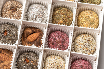 Candies in a white box made of dried fruits, without sugar and dyes. From natural ingredients....