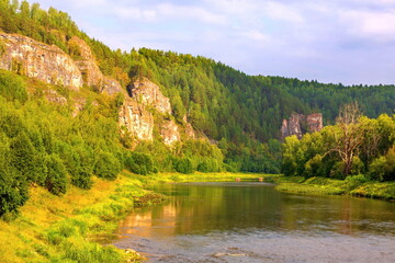 bank of the river Ai near the high fountain of the geyser on a summer sunny day