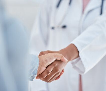 Handshake, trust and thank you with patient and doctor or medical worker shaking hands, greeting or introduction during consultation. People hand welcome gesture or welcome, partnership or help