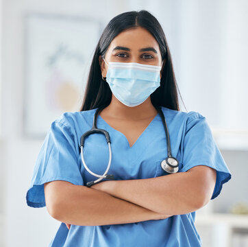 Nurse, Doctor And Covid Face Mask In Hospital With Motivation, Confidence And Arms Crossed. Health Expert Or Medical Worker With Support In The Covid 19 Pandemic, Healthcare And Safety From Virus