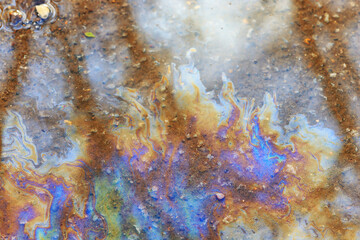 spilled gasoline rainbow background, industrial hazard spill pollution, abstract texture multicolored