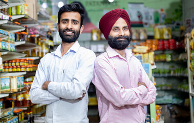Fototapeta na wymiar portrait of confident Indian grocery store owner 