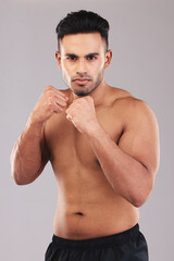 Fist, fight and portrait of an athlete in a studio for sports, MMA or martial arts training....
