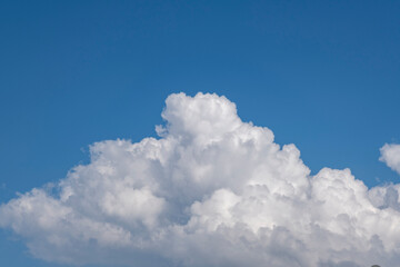 Fototapeta na wymiar Natural landscape.White clouds on a blue sky on a sunny day.