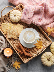 Fototapeta na wymiar White pumpkins, coffee and autumn leaves