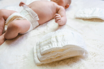 Diaper change newborn kid banner. Happy cute infant baby in nappy. Child care white background....
