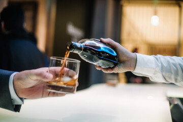 beautifully decorated cocktail in a nightclub, people drink a drink
