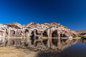 Volcano rock, pond reflection. Bolivia 