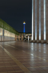 View of the national monument (monas) at night from Itiqlal Mosque, Jakarta